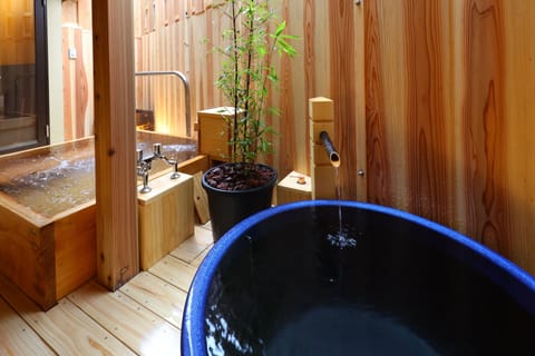 Deluxe Japanese-Style Room with Open-Air Bath  | Bathroom | Hair dryer, slippers, electronic bidet, towels