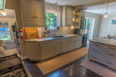 Fully stocked kitchen that opens to the dining room.