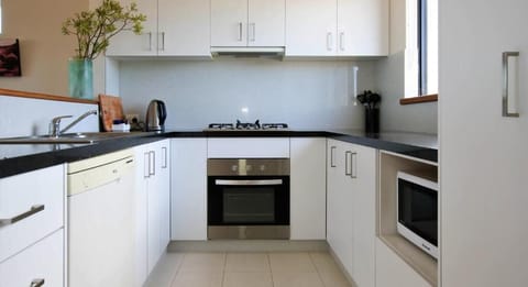 Two Bedroom Townhouse | Private kitchen | Fridge, microwave, stovetop, coffee/tea maker