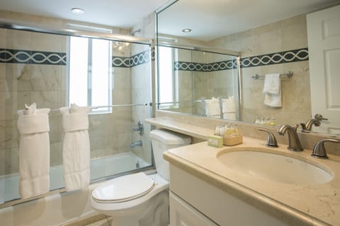 Suite, 1 Bedroom, Partial View | Bathroom | Shower, hair dryer, towels