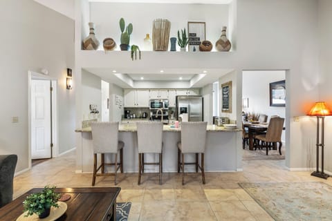 Stainless steel appliances, ample counter space, and a island with counter stool seating for three (3).