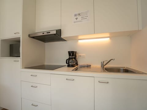 Countertop, Interior Design, Kitchen, Cabinetry, Wood, Kitchen Appliance, Flooring, Kitchen Sink, Floor, Room