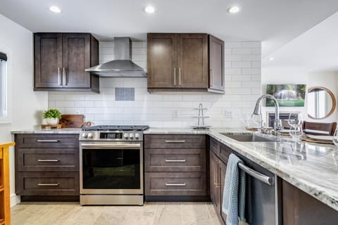 White quartz counters meet natural wood textures.