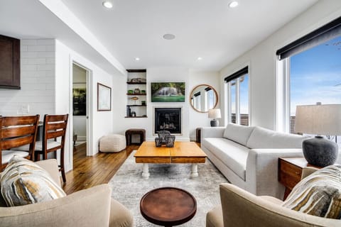 Crisp white walls paired with natural wood finishes.