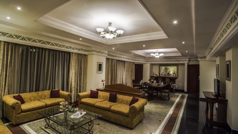 Presidential Suite, 1 Bedroom, Garden View | Living area | 32-inch LED TV with satellite channels, TV