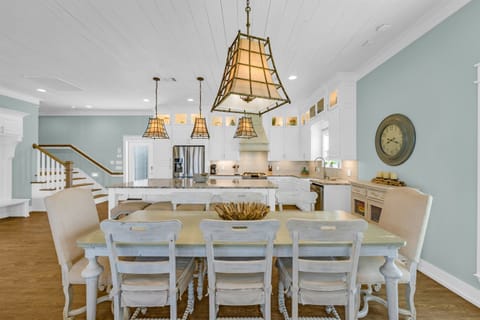 Sea It All: Dining area seats up to 8 at the modern farmhouse chic dining table.