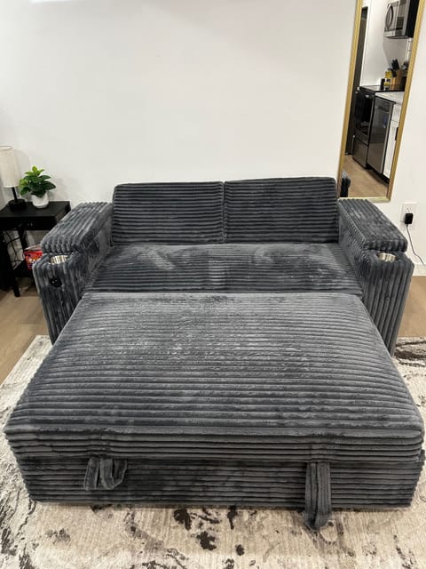 Lounge on comfy couch with free Peacock TV.