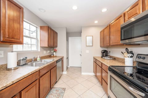 The inviting kitchen offers ample space & every home comfort