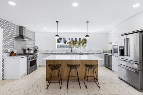 Chef's kitchen with a huge island