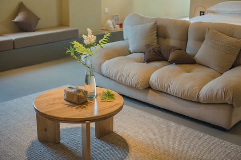 Classic Studio Suite, Hill View | Living area | 65-inch LCD TV with cable channels, heated floors