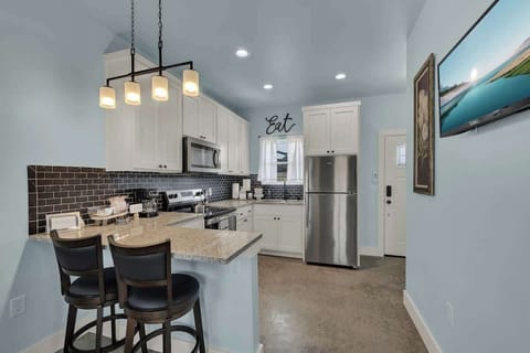 The full kitchen comes equipped with modern appliances, ample counter space, and all the essentials you need to prepare delicious meals during your stay.