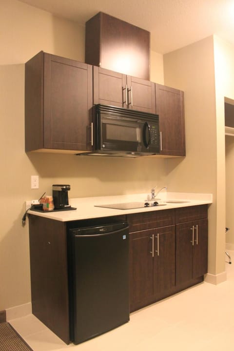 Suite, 2 Bedrooms | Private kitchen | Mini-fridge, microwave, coffee/tea maker