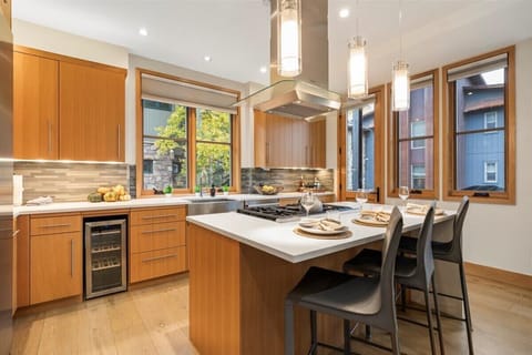 Kitchen: gas stove, island with seating for 3, coffee machine