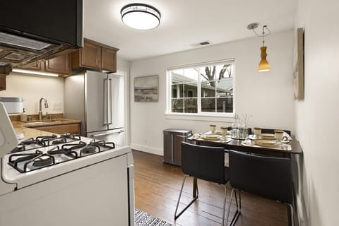 Start your day with a bright breakfast or wind down over dinner in this sunny dining nook.