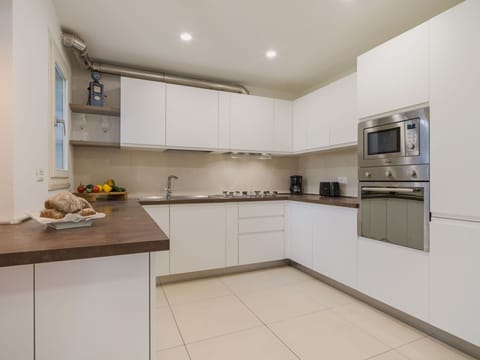 Kitchen, Kitchen Appliance, Countertop, Cabinetry, Major Appliance, Interior Design, Kitchen Stove, Stove, Flooring, Wood