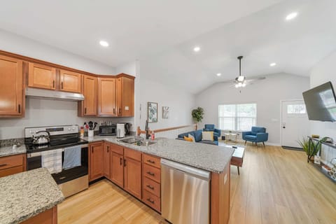 Kitchen: A modern kitchen with granite countertops and stainless steel appliances.