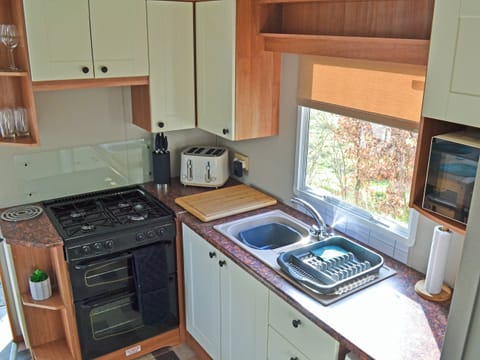Kitchen area | The Lodge - Island Hut Retreats, Rhosmeirch, near Benllech