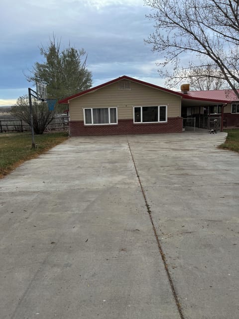 Driveway with Basketball net.  Basket balls provided.
