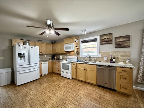 Newly remodeled kitchen with updated appliances and a dishwasher.