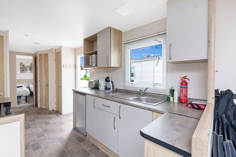 Fully equipped kitchen with modern appliances and ample counter space—perfect for preparing meals during your stay.