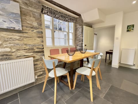 Dining table into hallway of 36 High Street Holiday Cottage, Padstow, North Cornwall