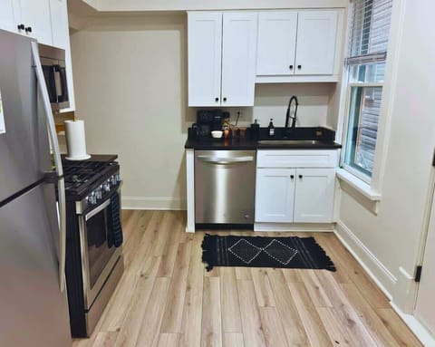 Elevate your culinary experience at Jungle House Airbnb with our sleek and modern kitchen, complete with stainless steel appliances and elegant finishes Your gourmet retreat in Short North Columbus