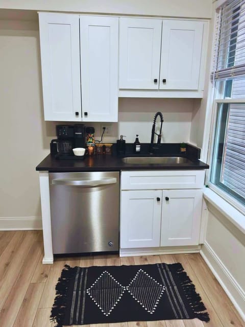 Enjoy your mornings in our modern Jungle House kitchen in Columbus! Our Keurig coffee maker is ready to fuel your adventures. & Our plants are looking forward to hosting you soon Book your stay now and experience the perfect blend of comfort and