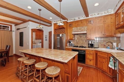 Fully equipped kitchen with stainless steel appliances.