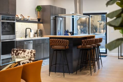 Center of the Action – This oversized island invites everything from morning coffee to late-night wine and conversation.