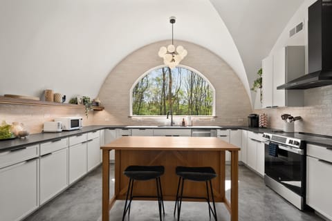 Modern Fully Equipped Kitchen with Bar Seating