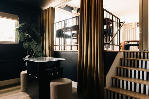 Secondary living room featuring an arcade table with hundreds of retro arcade games!