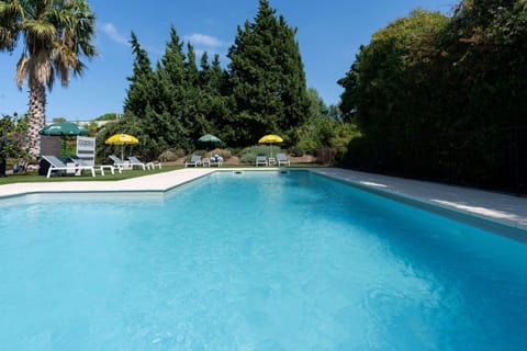 Outdoor pool, open 10:00 AM to 8:30 PM, pool umbrellas, sun loungers