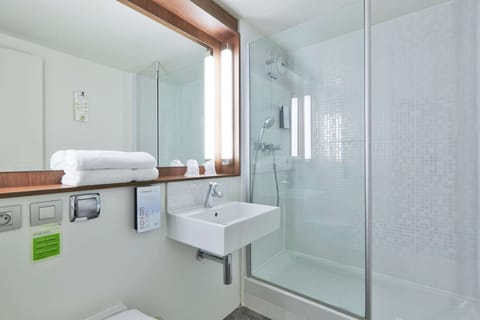 Shower, eco-friendly toiletries, hair dryer, towels