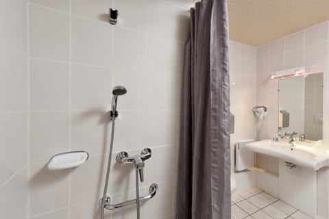 Shower, eco-friendly toiletries, hair dryer, towels