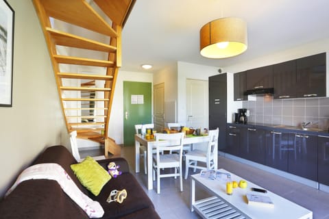 The living area is bright and cozy, perfect for relaxing after a wonderful day.