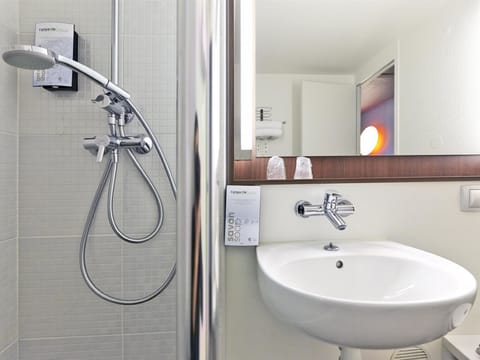 Shower, eco-friendly toiletries, hair dryer, towels