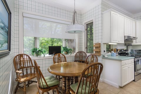 Kitchen with drip-style coffee pot, breakfast nook for 6, and island seating for 2