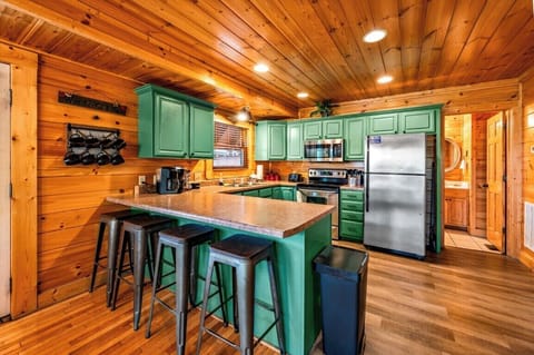 Bright and inviting space with vibrant green cabinets, perfect for culinary adventures!