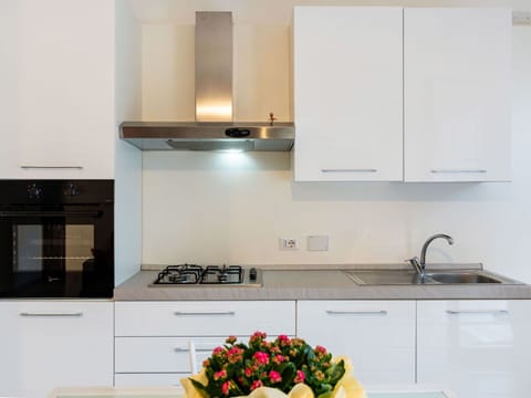 Kitchen, Countertop, Kitchen Appliance, Major Appliance, Cabinetry, Interior Design, Wood, Kitchen Stove, Stove, Home Appliance