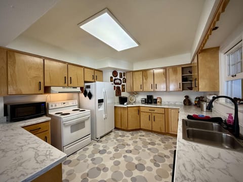 Large kitchen with ample cupboard and counter space