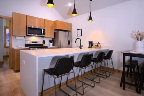 Bar height seating at counter and table space