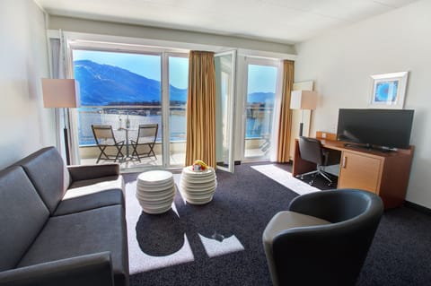 Panoramic Suite, Lake View | Living area | 32-inch flat-screen TV with cable channels, TV