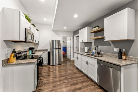 Our Complete kitchen setup Includes a full-size fridge, oven, stovetop, microwave, and dishwasher.