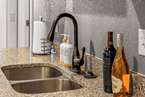 A sleek and tidy sink space that keeps things functional while looking effortlessly stylish.