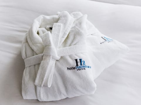 Eco-friendly toiletries, hair dryer, slippers, towels