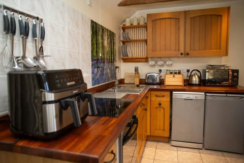 Kitchen with microwave, fridge and toaster