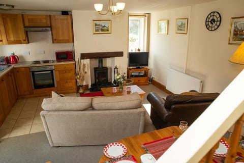 View from stairs overlooking the living/kitchen area