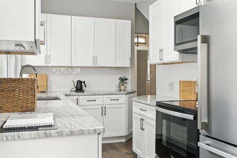 Full size fridge, electric cooktop and oven, Microwave. Fully Stocked.