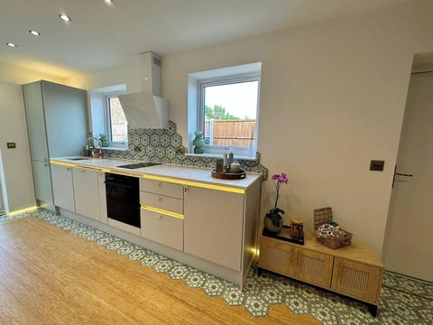 A stylish kitchen space designed for effortless self-catering during your stay.