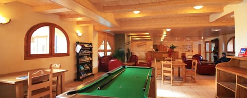 Enjoy the pool table, available for a charge.